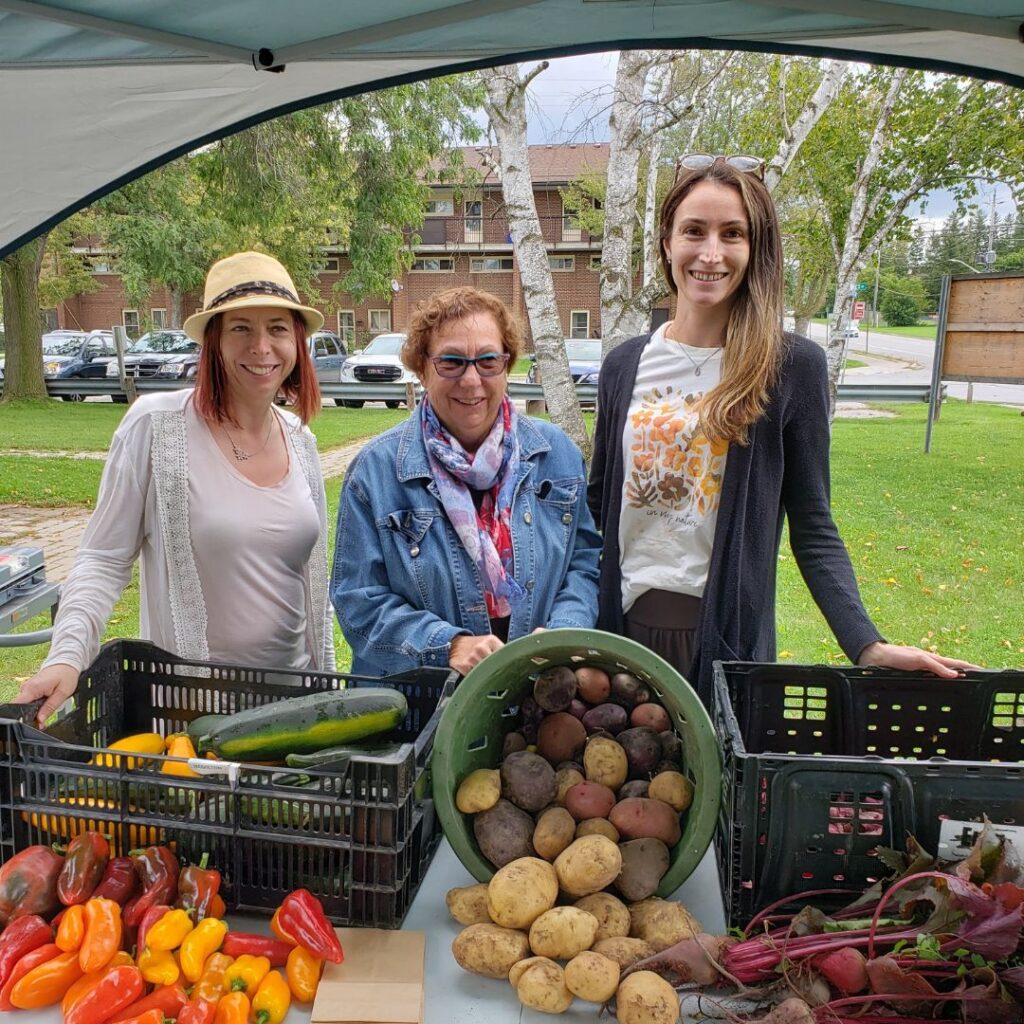 Shantal Ingram, Penny Barton Dyke and Emily Beall are pictured at the Edwin Binney's Community Garden Farm Stand located at 50 Mary Street West in Lindsay.